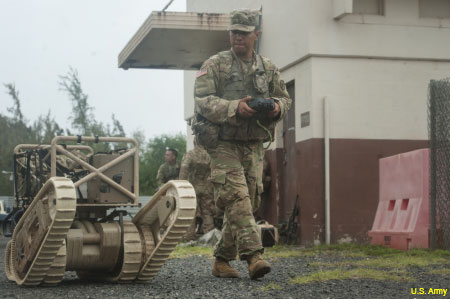 A soldier operates the MUTT ground vehicle.